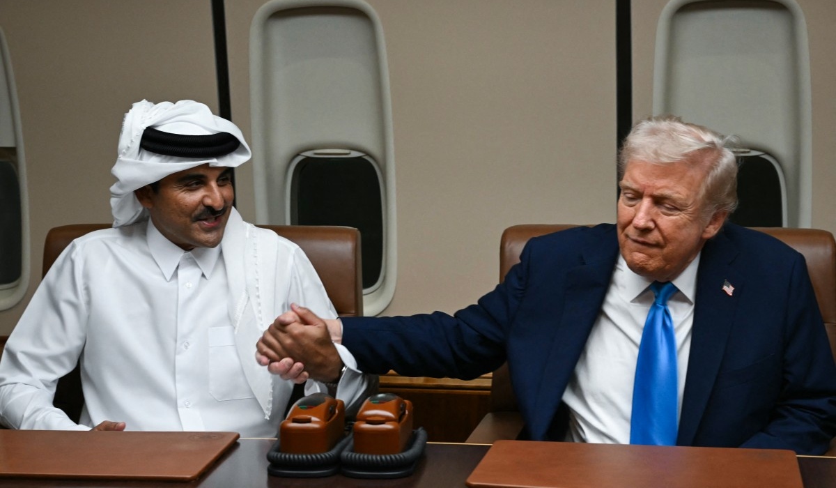 الرئيس الأميركي وأمير قطر (أ ف ب)