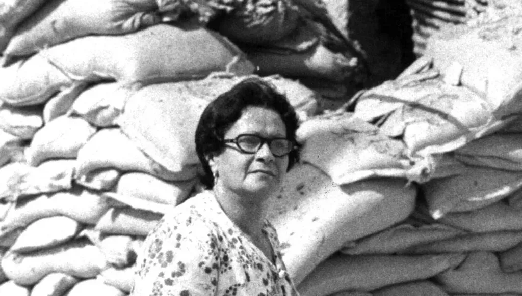A woman walking among the rubble after the announcement of a ceasefire – 22/9/1983 – Gamma Agency