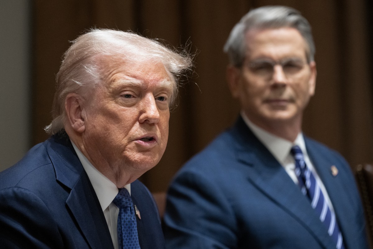 سكوت بيسنت وترامب (ا ف ب)