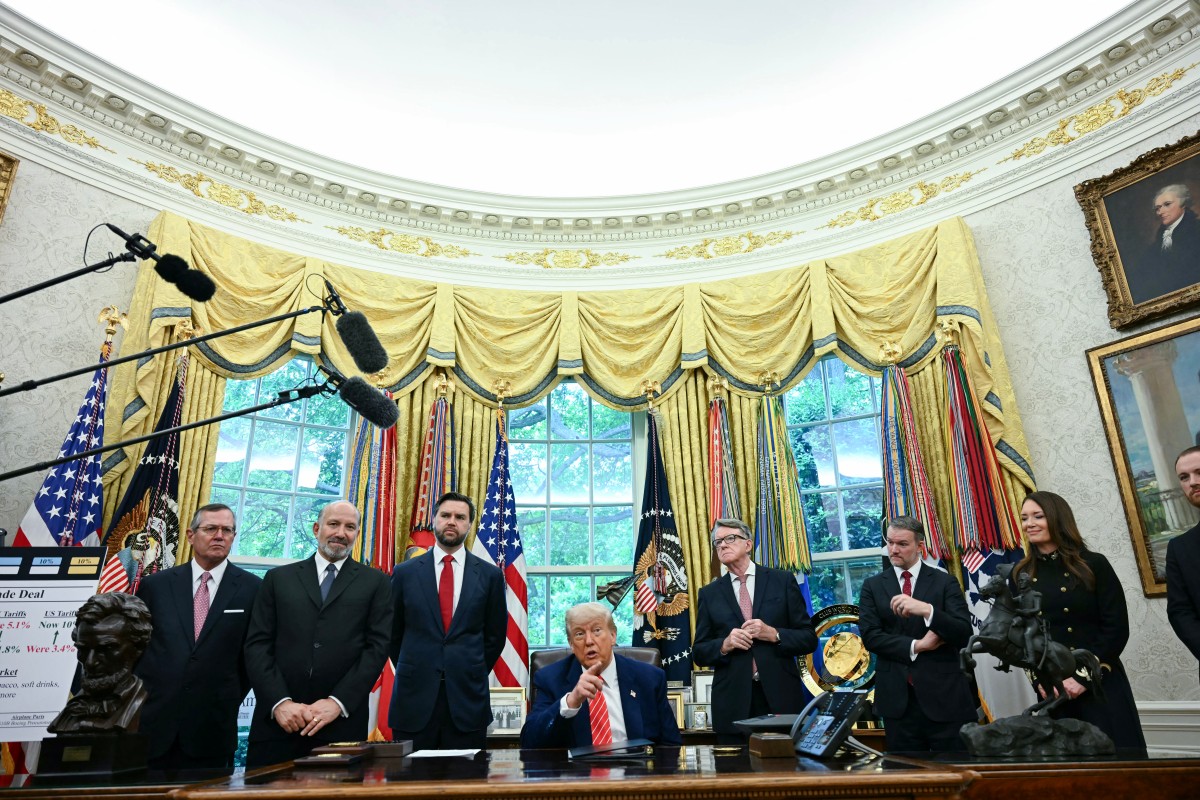 خلال إعلان الاتفاق التجاري (أ ف ب).