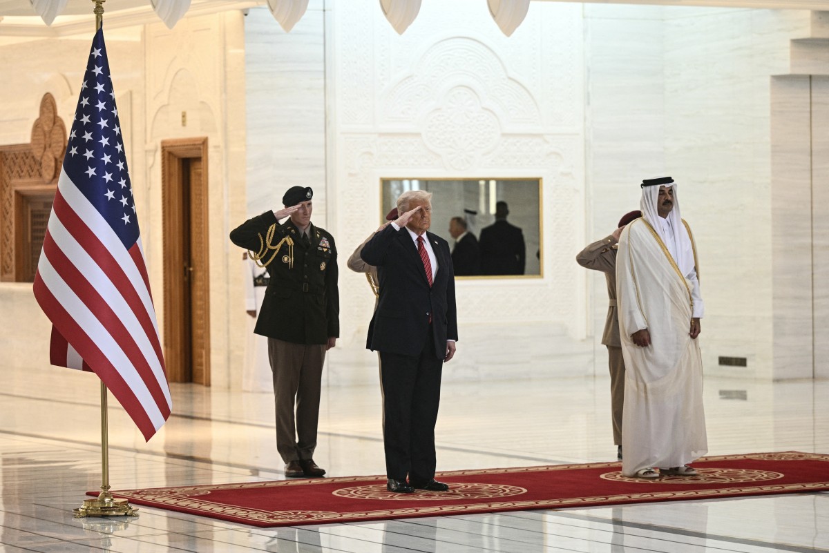 استقبال رسمي لترامب في الدوحة (أ ف ب).