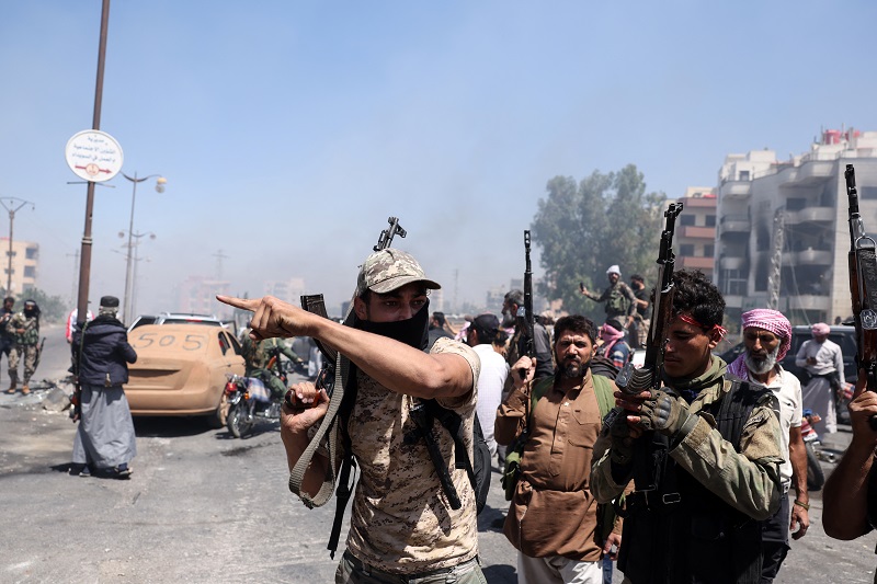 مقاتلون من العشائر في السويداء (أ ف ب)