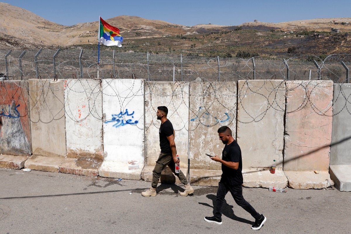 السياج الشائك بالقرب من قرية مجدل شمس الدرزية في مرتفعات الجولان (أ ف ب).