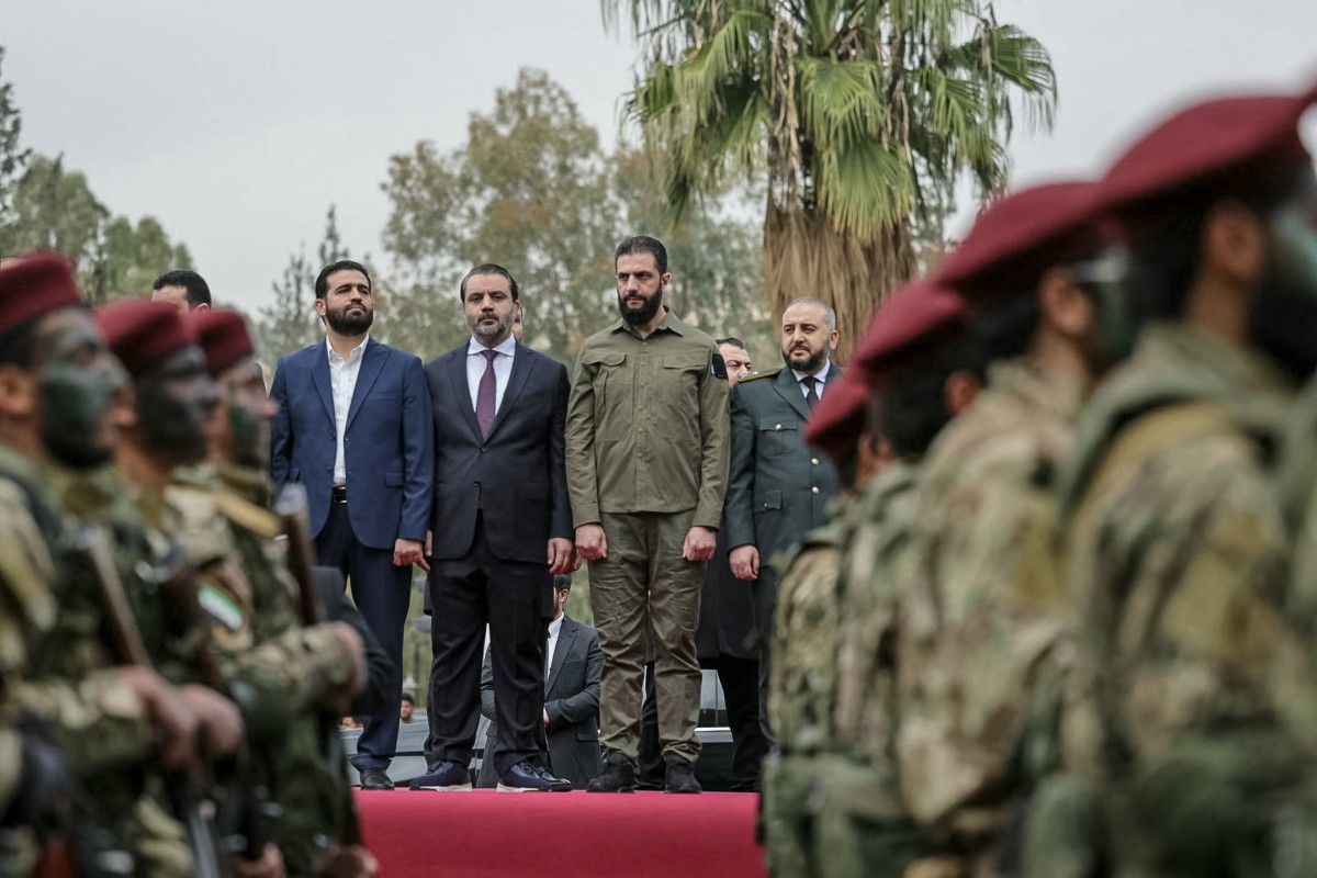 الشرع مشاركاً في الاستعراض العسكري بدمشق. (أ ف ب)