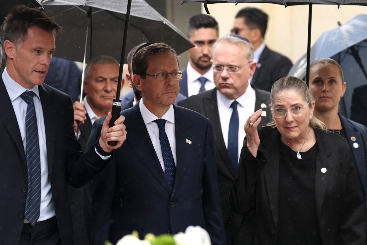 هرتسوغ في أستراليا. (أ ف ب)