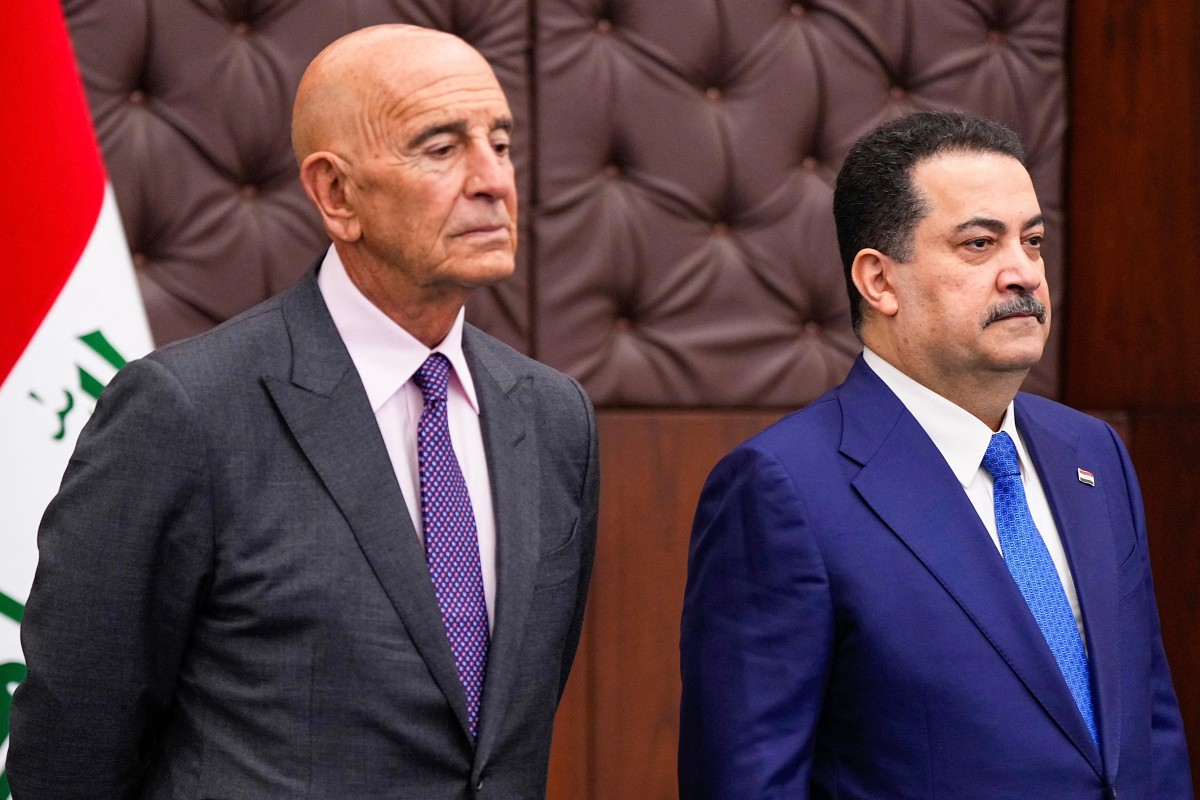 رئيس الوزراءالعراقي محمد شياع السوداني والمبعوث الأميركي الى العراق توم براك.(أف ب)