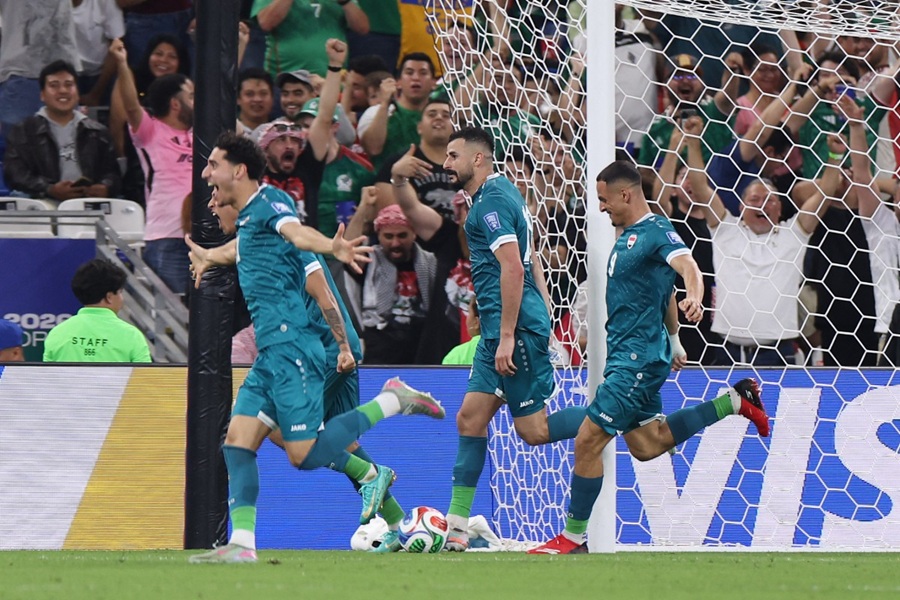 لاعبو العراق. (أ ف ب)