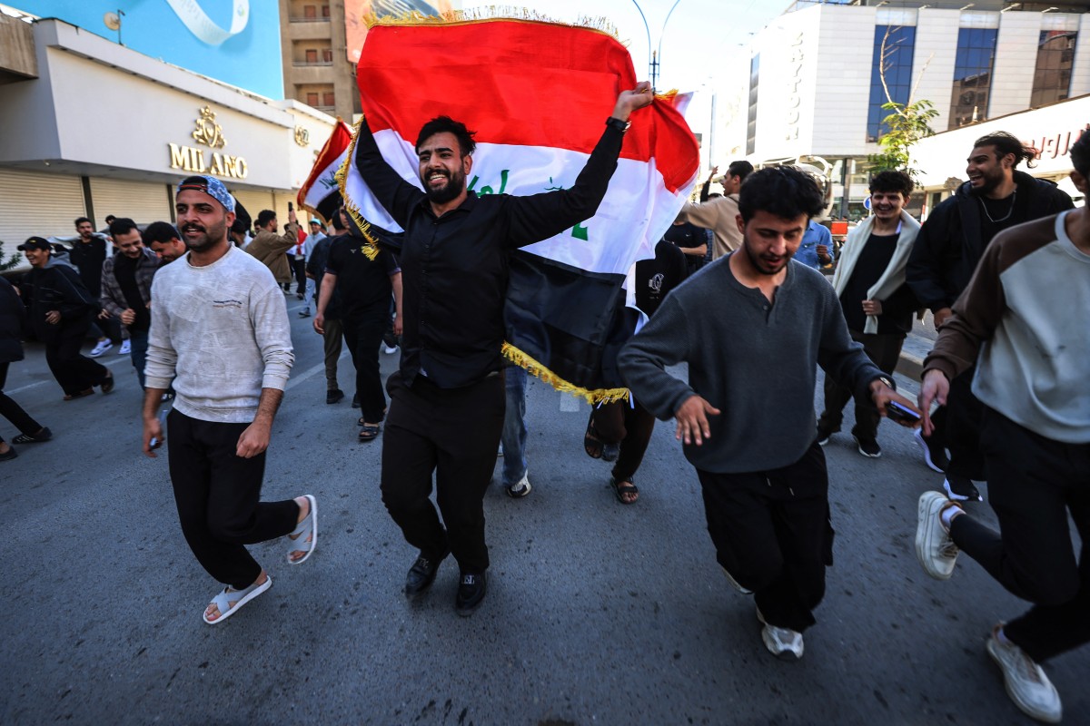 احتفالات الشعب العراقي في الشوارع بعد حسم التأهل إلى كأس العالم 2026. (أ ف ب)