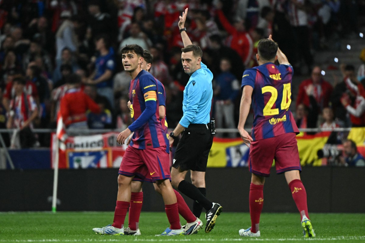 من مباراة برشلونة وأتلتيكو مدريد في إياب ربع نهائي دوري أبطال أوروبا. (أ ف ب)