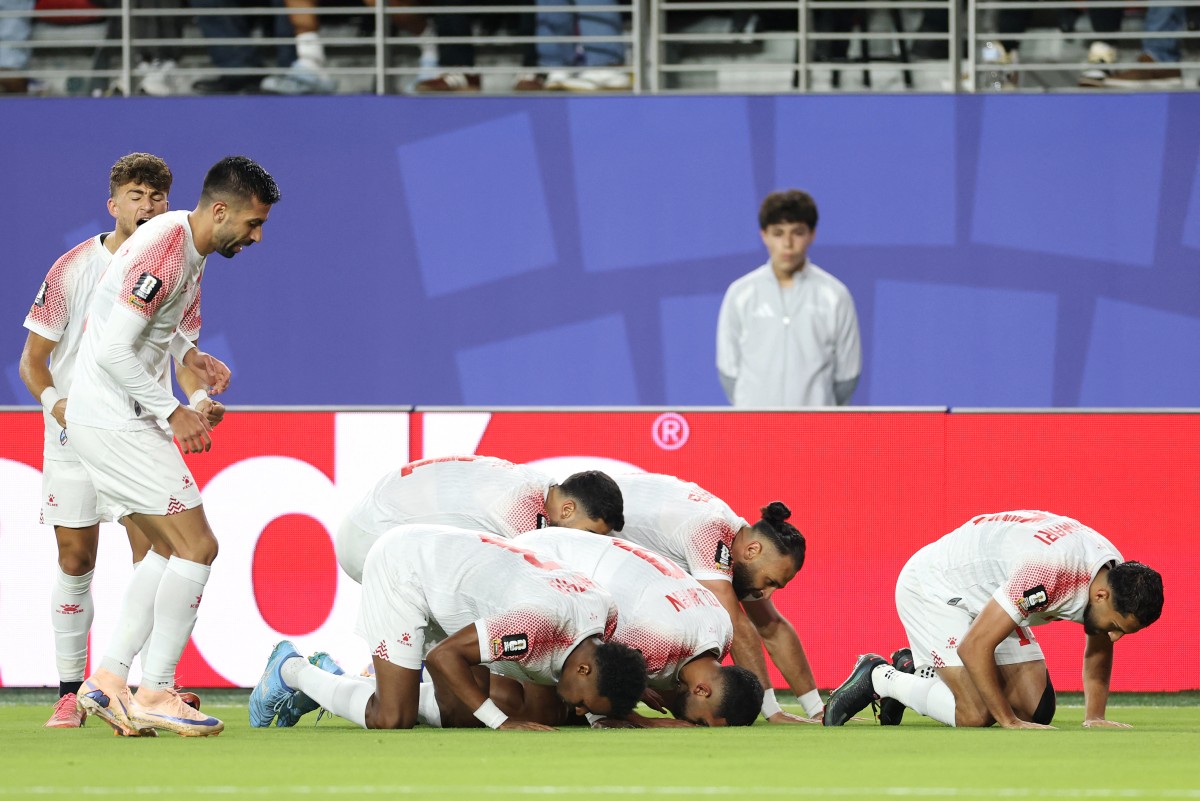 لاعبو الأردن. (أ ف ب)