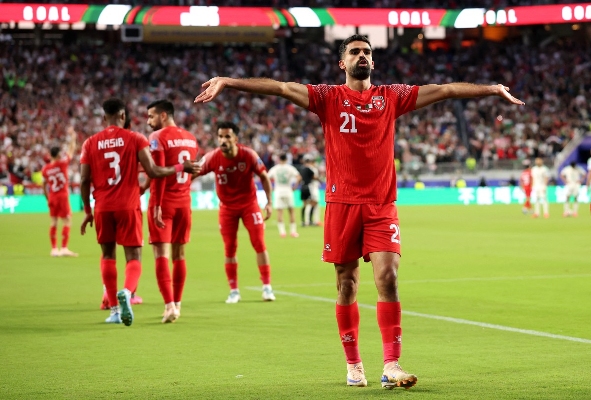 الرشدان يحتفل بالهدف الأول للأردن. (أ ف ب)