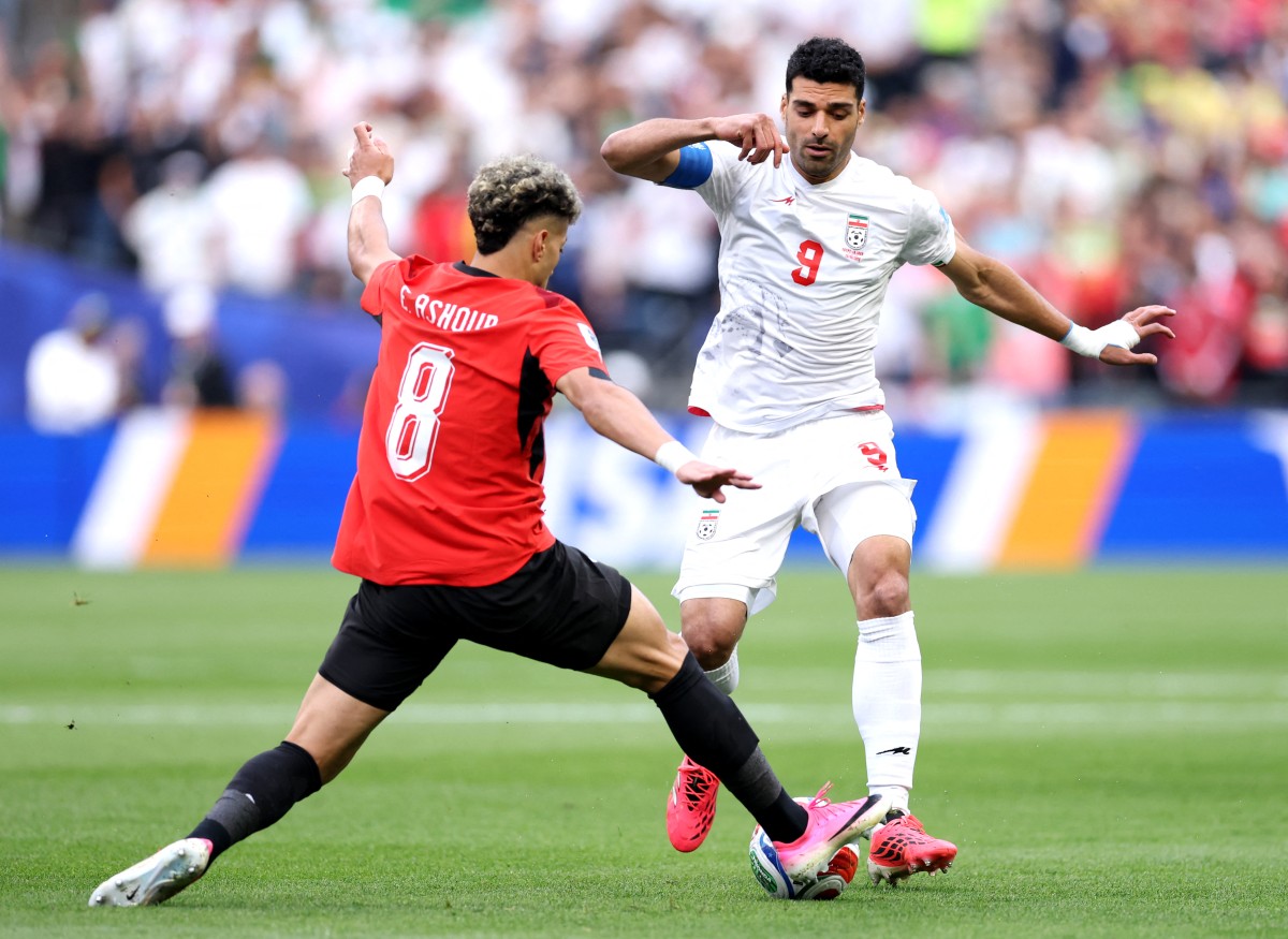 مهدي طارمي خلال مواجهة مصر في كأس العالم. (أ ف ب)
