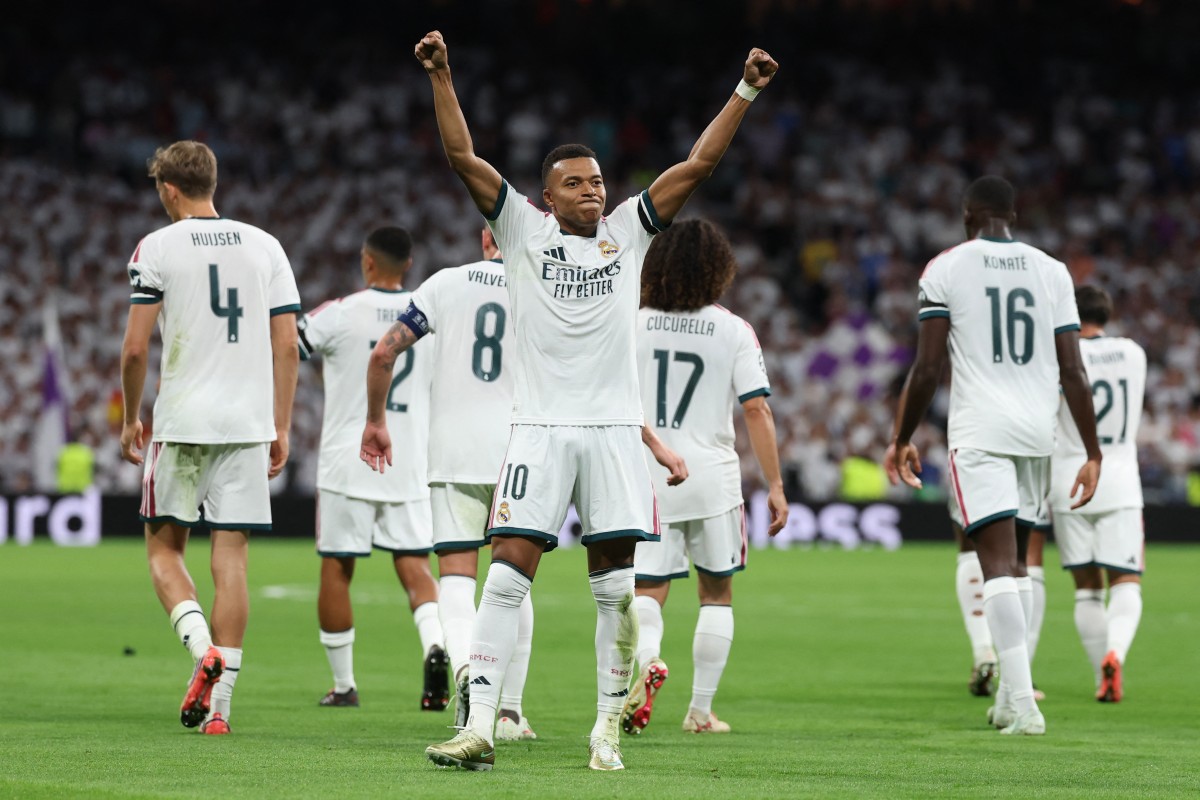 فرحة مبابي بعد تسجيله هدف التقدم لريال مدريد أمام إنتر. (أ ف ب)