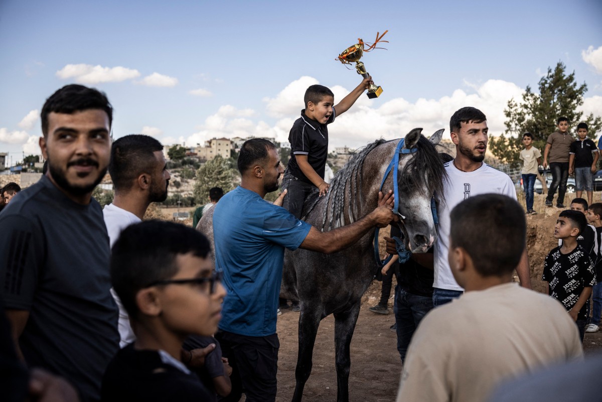 سباق الخيل يعود إلى قرية المجد الفلسطينية. (أ ف ب)