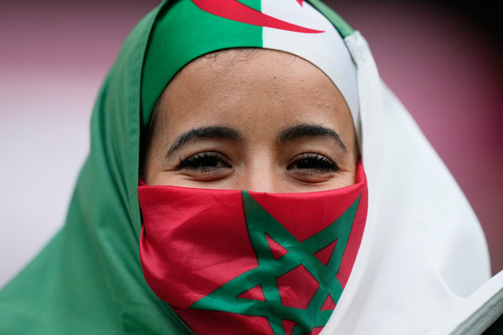 A fan wats for the start of the Africa Cup of Nations group E soccer match between Algeria and Sudan in Rabat, Morocco, Wednesday, Dec. 24, 2025. (AP Photo/Mosa'ab Elshamy)