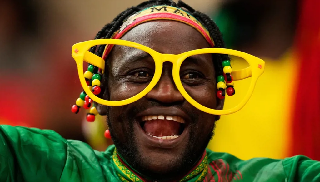 A Mali soccer fan waits for the start of the African Cup of Nations Group A soccer match between Morocco and Mali in Rabat, Friday, Dec. 26, 2025. (AP Photo/Mosa'ab Elshamy)