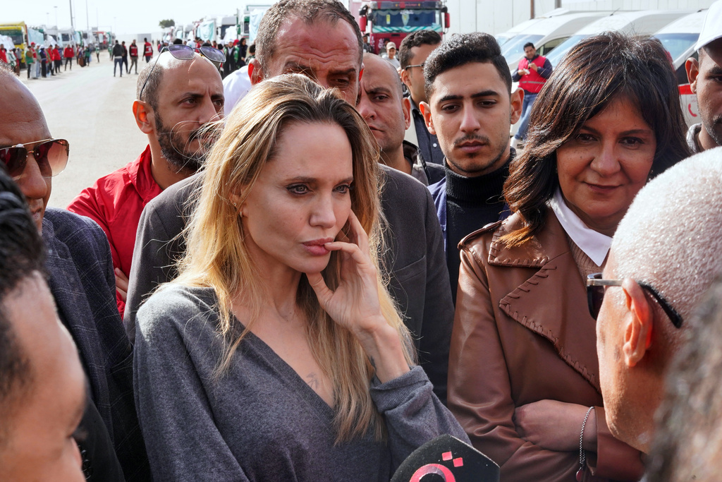 American actor and film producer Angelina Jolie, center, listens to North Sinai Governor Khaled Megahed during her visit to the Rafah border crossing between Egypt and the Gaza Strip in Rafah, Egypt, Friday, Jan. 2, 2026. (AP Photo/Mohamed Arafat)