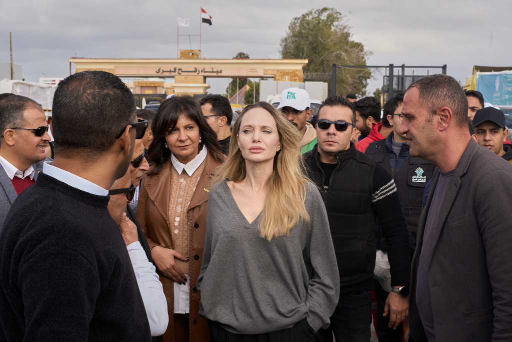 American actor and film producer Angelina Jolie, center, during her visit to the Rafah border crossing between Egypt and the Gaza Strip in Rafah, Egypt, Friday, Jan. 2, 2026. (AP Photo/Mohamed Arafat)