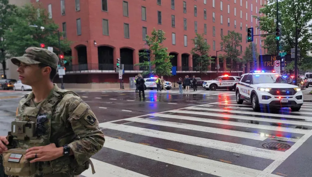 A member of the National Guard and police vehicles on a closed street near the White House. (AFP)