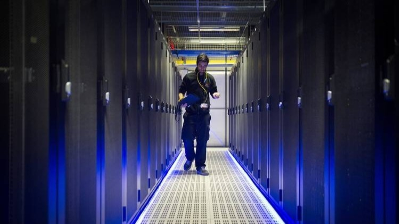 An Equinix employee checks servers at a data center in Paris. (AFP)
