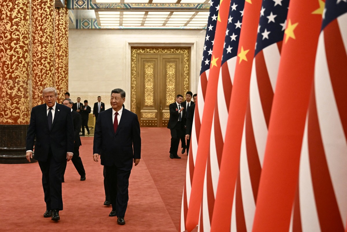 شي جينبينغ ودونالد ترامب يصلان لحضور مأدبة رسمية في قاعة الشعب الكبرى في بكين في 14 مايو 2026 (أ ف ب)