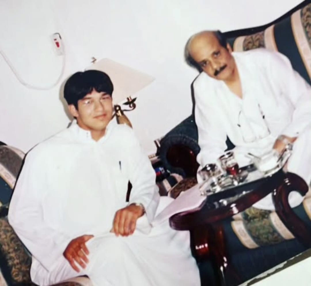 Saudi journalist and writer Ahmed Adnan in a photo with the late Talal Maddah in 1999.