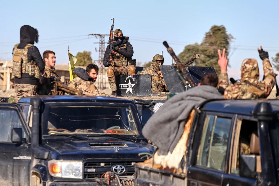 Soldiers of the Kurdish-led, U.S.-backed Syrian Democratic Forces deploy with armored vehicles near Gweiran Prison in Hassakeh, northeastern Syria. (AP)