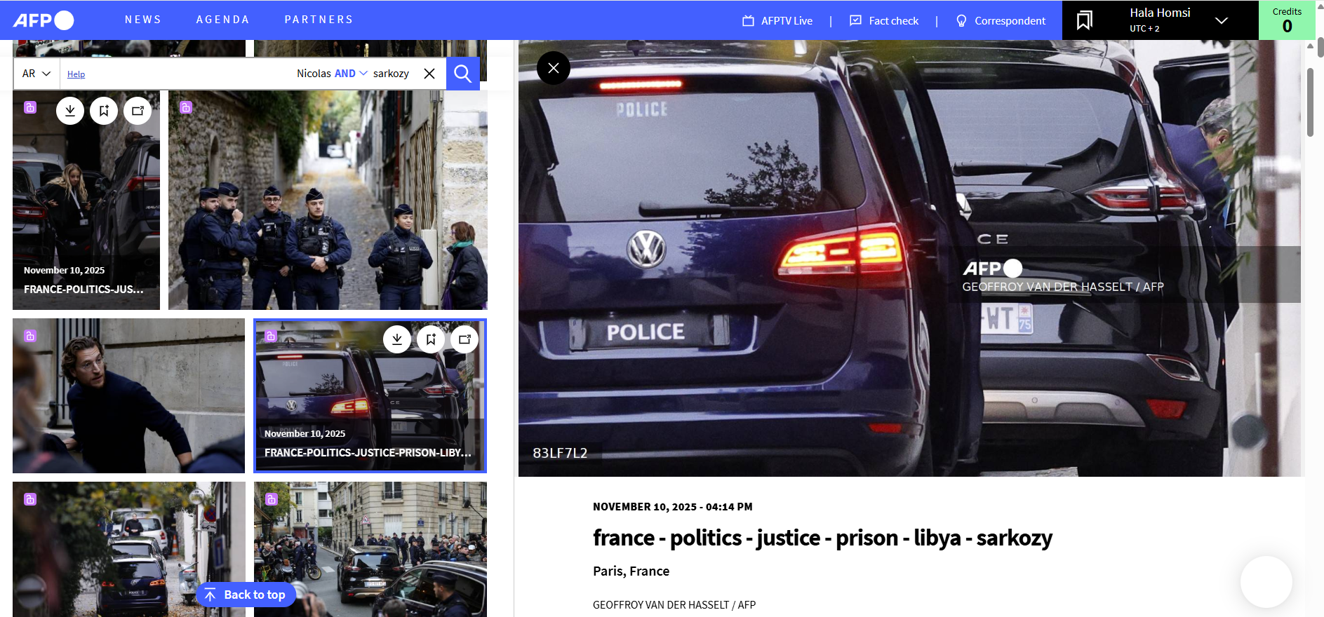 ساركوزي يظهر جزئيًا خلال خروجه من السيارة لدى وصوله إلى منزله بعد الافراج عنه (10 تشرين الثاني 2025، أ ف ب)