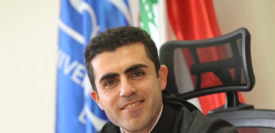 الأب طلال هاشم.