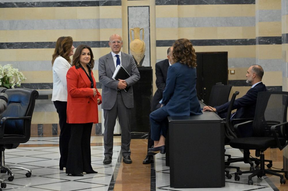 Several ministers exchange conversation ahead of the Cabinet session at the Grand Serail.
