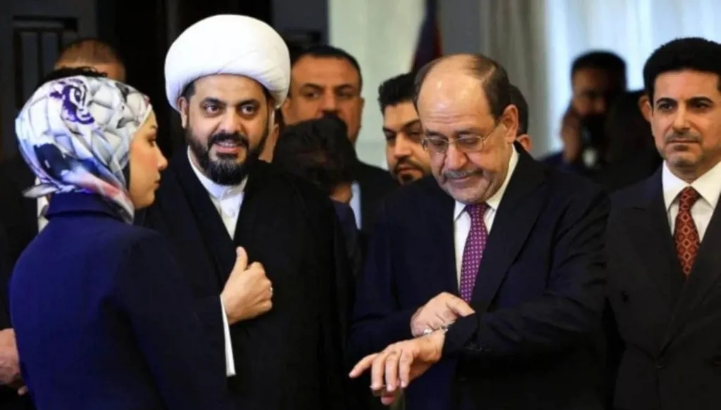 نوري المالكي وقيس الخزعلي خلال لقاء سابق. (أ ف ب)