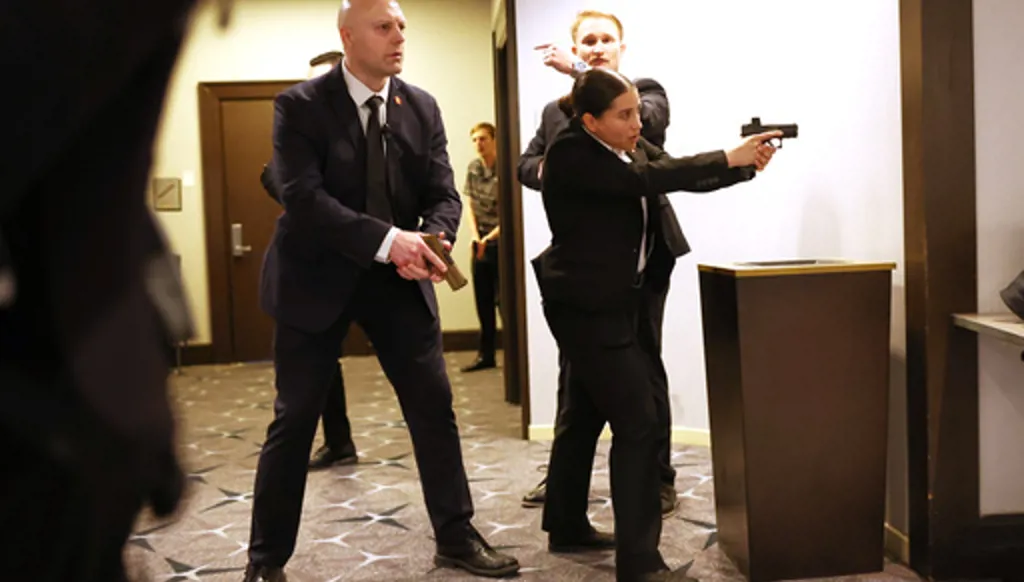 Members of law enforcement respond during the White House Correspondents Dinner, Saturday, April 25, 2026, in Washington. (AP Photo/Tom Brenner)