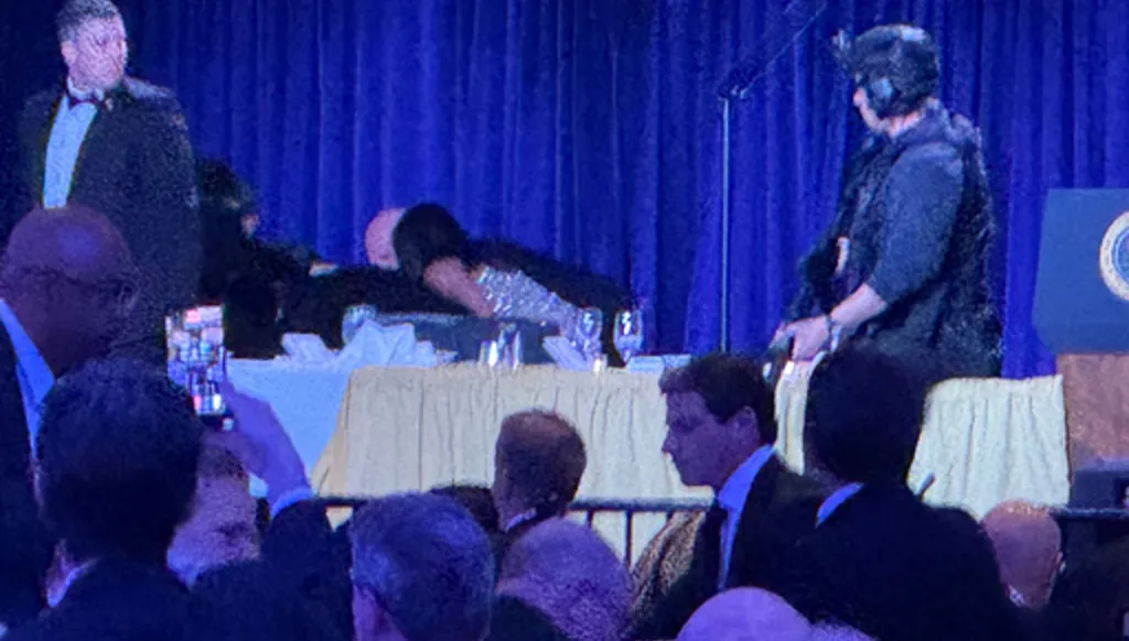 Secret service agents respond during the White House Correspondents Dinner, Saturday, April 25, 2026, in Washington. (AP Photo/Mark Schiefelbein)