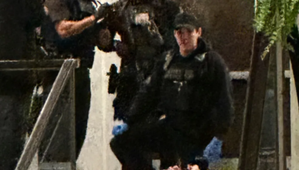 Members of law enforcement control shooting suspect Cole Tomas Allen during the White House Correspondents Dinner, Saturday, April 25, 2026, in Washington. (AP Photo/Alex Brandon) ADDITION: Adds name of shooting suspect after name shared by law enforcement officials