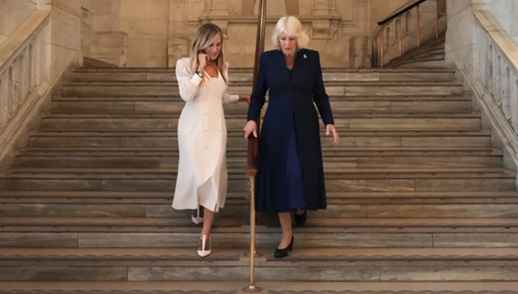 Britain's Queen Camilla walks with US actress Sarah Jessica Parker as she attends a literacy event at the New York Public Library in New York, Wednesday, April 29, 2026. (Adam Gray/Pool Photo via AP)