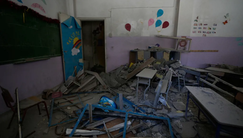 A classroom at a school is in ruins after it was hit days ago by an Israeli airstrike in the southern port city of Tyre, Lebanon, Thursday, April 30, 2026. (AP Photo/Hussein Malla)