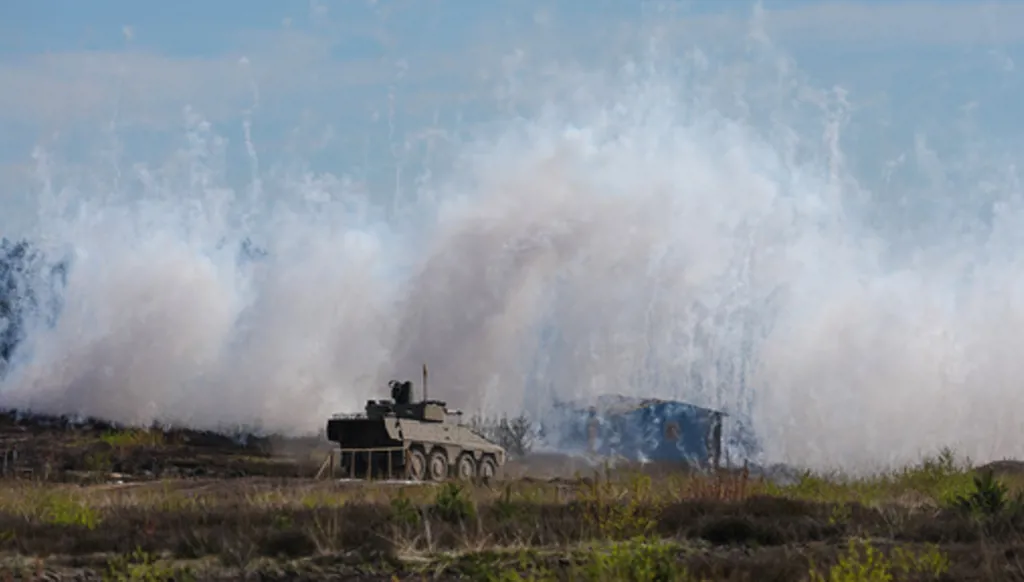 Bundeswehr troops demonstrate their capabilities during a visit of German Chancellor Friedrich Merz to the army at the Bundeswehr base in Munster, Germany, Thursday, April, 30, 2026. (AP Photo/Markus Schreiber)