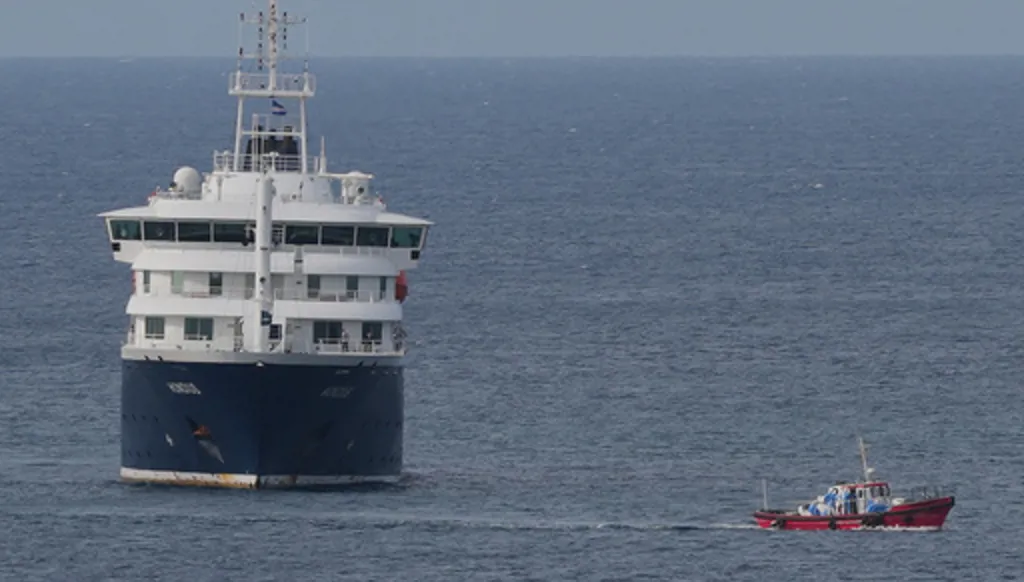 The MV Hondius cruise ship is anchored at a port in Praia, Cape Verde, Wednesday, May 6, 2026. (AP Photo/Misper Apawu)