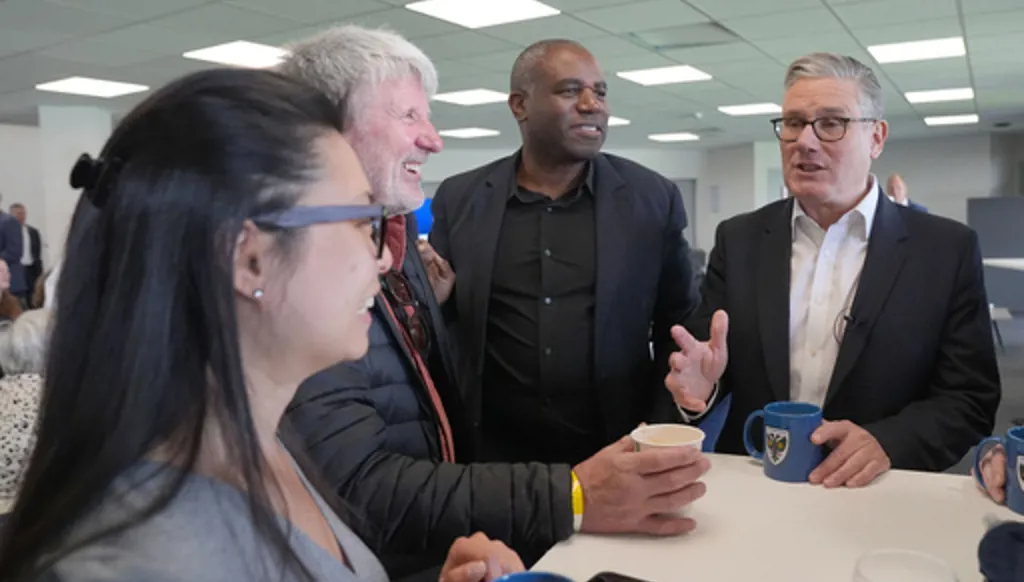 British Prime Minister Sir Keir Starmer and Foreign Secretary David Lammy meeting Labour Party members during a visit to AFC Wimbledon in south London, Saturday May 9, 2026. (Maja Smiejkowska/PA via AP)