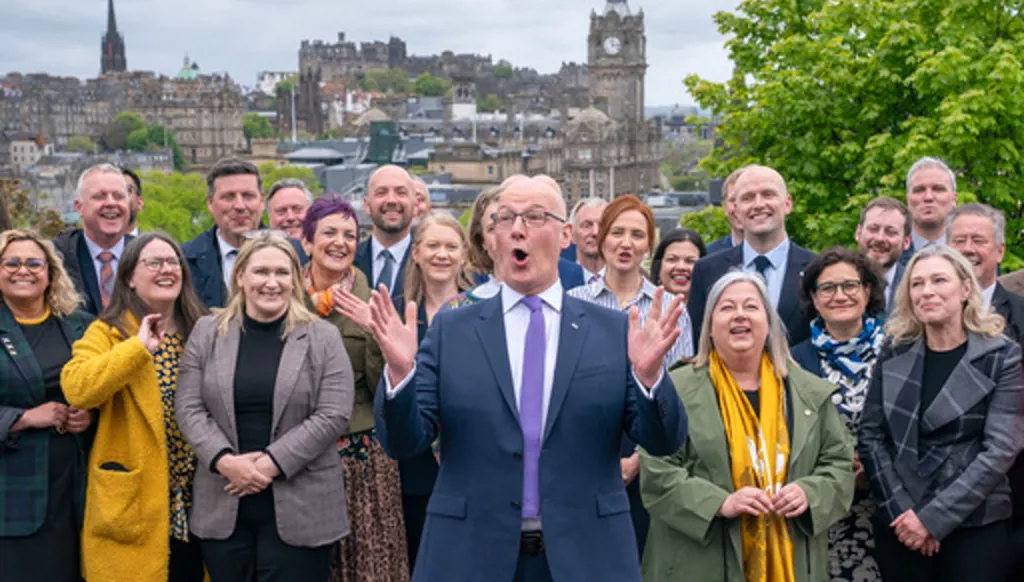 First Minister and SNP leader John Swinney with some of the newly elected SNP MSPs in Edinburgh, Saturday May 9, 2026, following the 2026 Holyrood elections. (Jane Barlow/PA via AP)