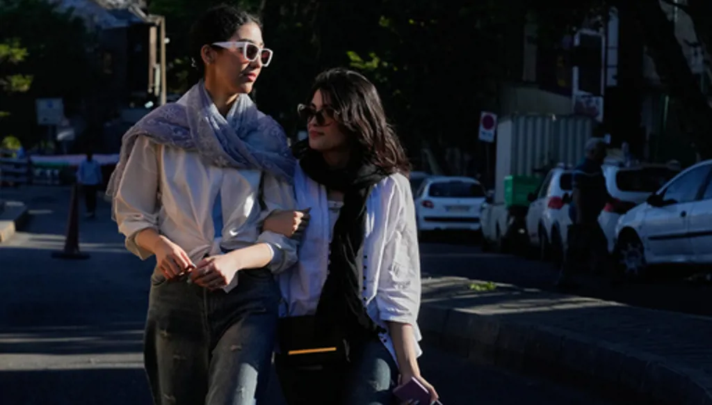Women walk in northern Tehran, Iran, Sunday, May 10, 2026. (AP Photo/Vahid Salemi)