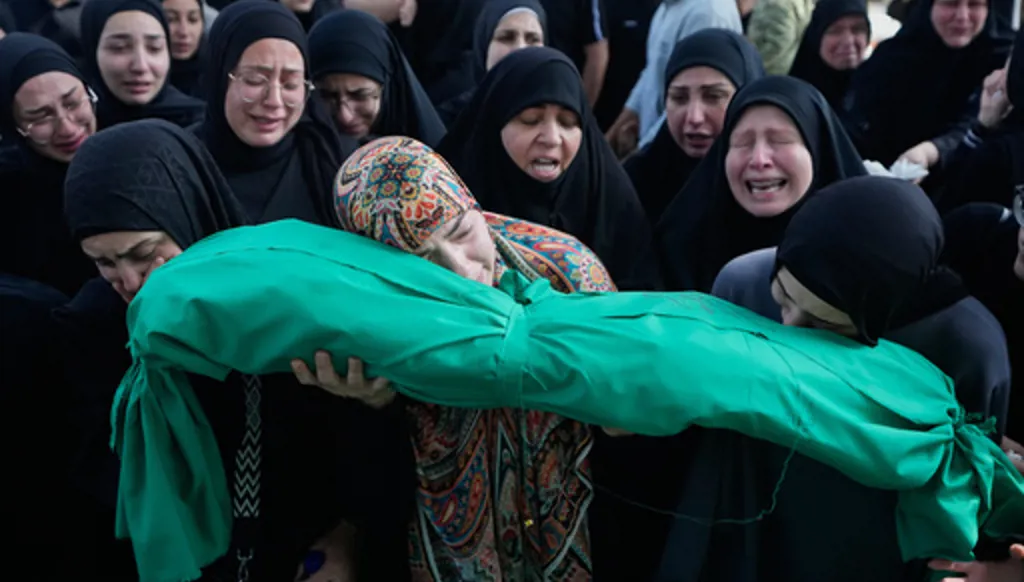 Women grieve as they carry the body of 6-month-old Mariam Fahos during a funeral procession for people killed a day earlier in an Israeli airstrike in the village of Saksakieh, in the southern port city of Sidon, Lebanon, Sunday, May 10, 2026. (AP Photo/Mohammed Zaatari)