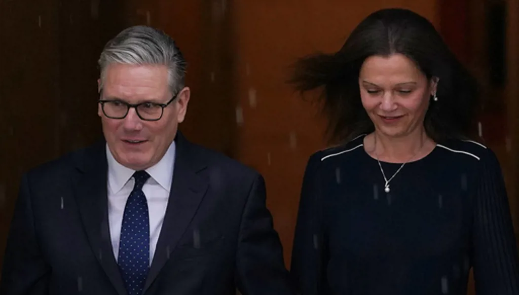 Britain's Prime Minister Keir Starmer and wife Victoria leave 10 Downing Street to attend the State Opening of Parliament at the Houses of Parliament in London, Wednesday, May 13, 2026.(AP Photo/Alberto Pezzali)