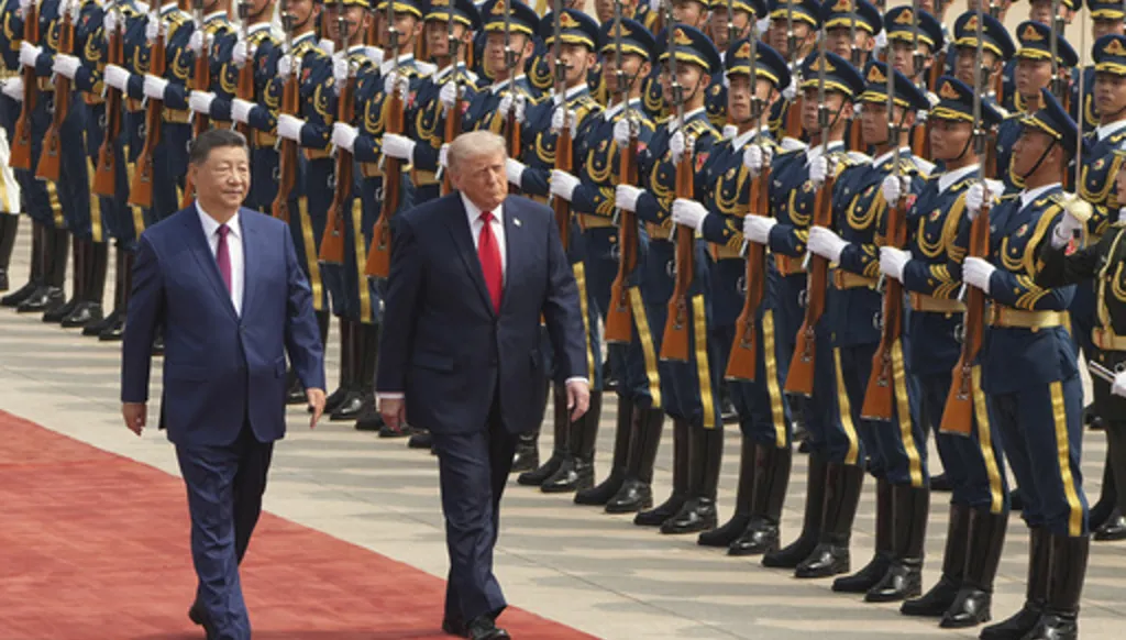 President Donald Trump participates in a welcome ceremony with China's President Xi Jinping at the Great Hall of the People, Thursday, May 14, 2026, in Beijing. (AP Photo/Mark Schiefelbein)