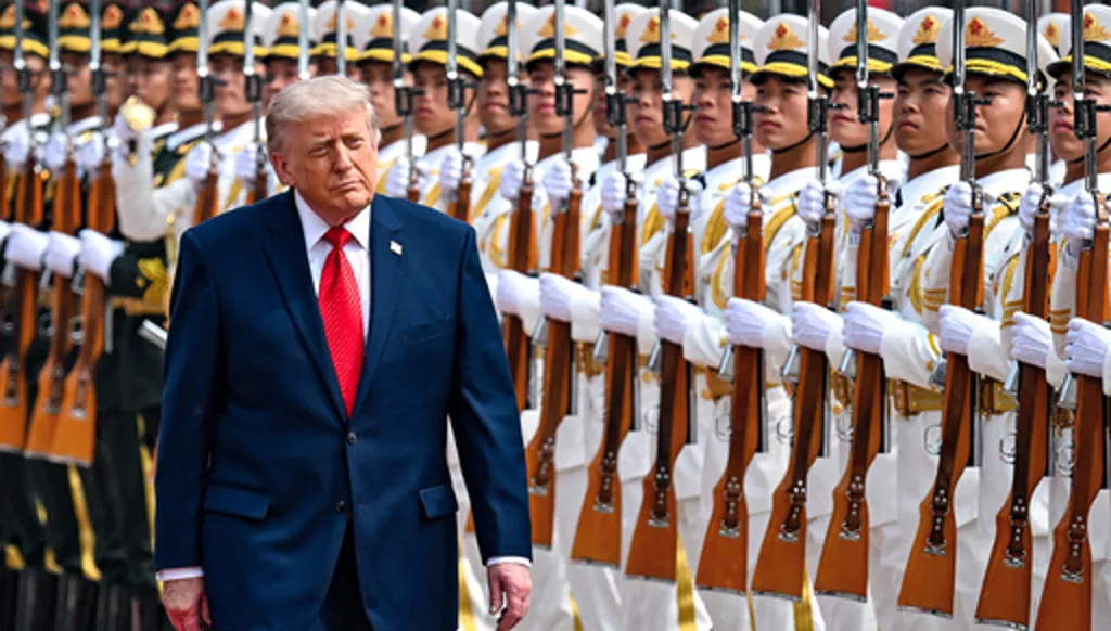 President Donald Trump reviews troops at the Great Hall of the People, Thursday, May 14, 2026, in Beijing. (Kenny Holston/The New York Times via AP, Pool)