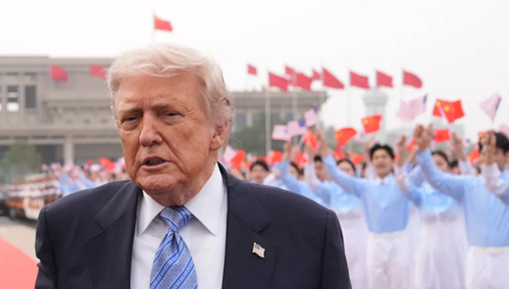 President Donald Trump walks to board Air Force One, Friday, May 15, 2026, at Beijing Capital International Airport in Beijing. (AP Photo/Mark Schiefelbein)
