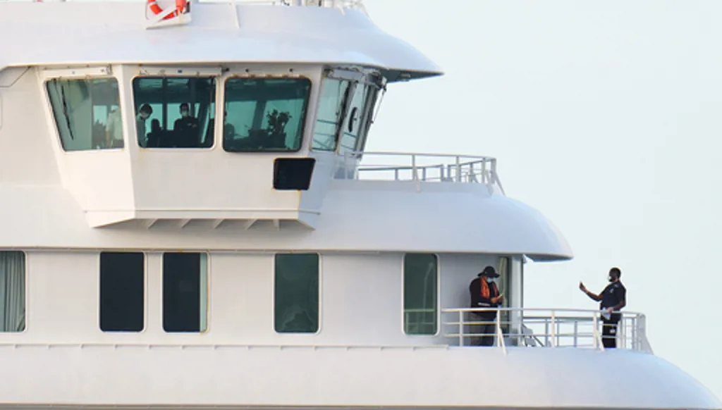 Passengers and crew at the hantavirus-stricken cruise ship MV Hondius after arriving at the port of Granadilla in Tenerife, Canary Islands, Spain, Sunday, May 10, 2026. (AP Photo/Manu Fernandez)