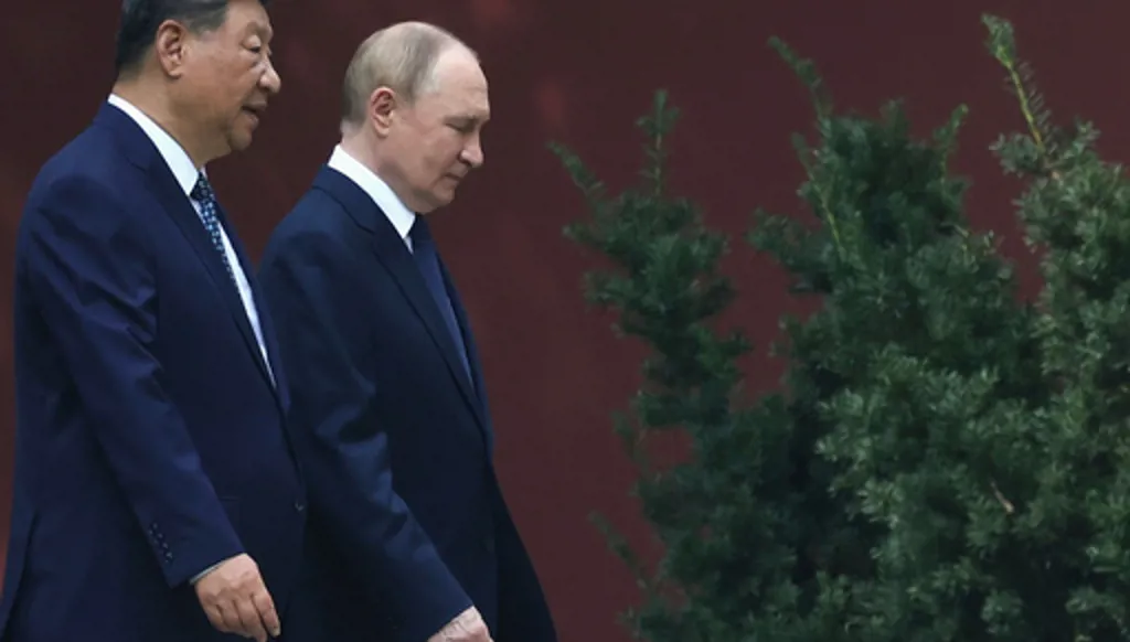 FILE - Russian President Vladimir Putin, right, speaks with Chinese President Xi Jinping during a walk at the Zhongnanhai leadership compound in Beijing, China, Sept. 2, 2025. (Alexander Kazakov, Sputnik, Kremlin Pool Photo via AP, File)