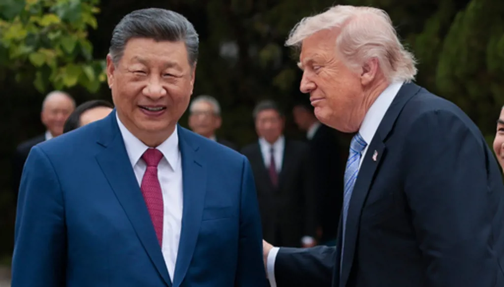 U.S. President Donald Trump, right, speaks with Chinese President Xi Jinping while leaving after a visit to the Zhongnanhai Garden in Beijing, Friday, May 15, 2026. (Evan Vucci/Pool Photo via AP)