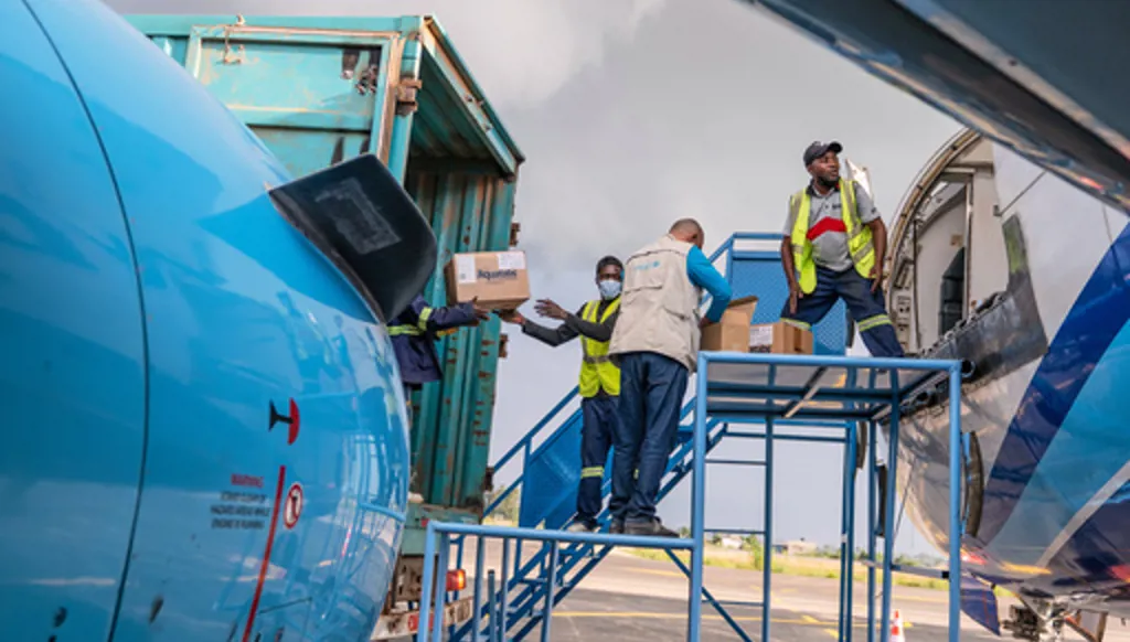 People offload a shipment of more than 15 tons of supplies donated by UNICEF as part of the response to the Ebola virus outbreak at Bunia National Airport in Bunia, Congo, Tuesday, May 19, 2026. (AP Photo/Moses Sawasawa)
